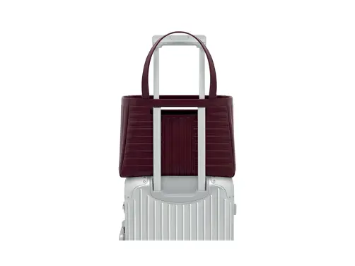 Swiss Deluxe Hotels H Magazine Summer 2026 RIMOWA Groove Shopping Bag Burgundy