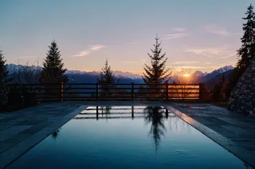 Lecrans Hotel Spa Crans Montana Sunset Pool View Summer
